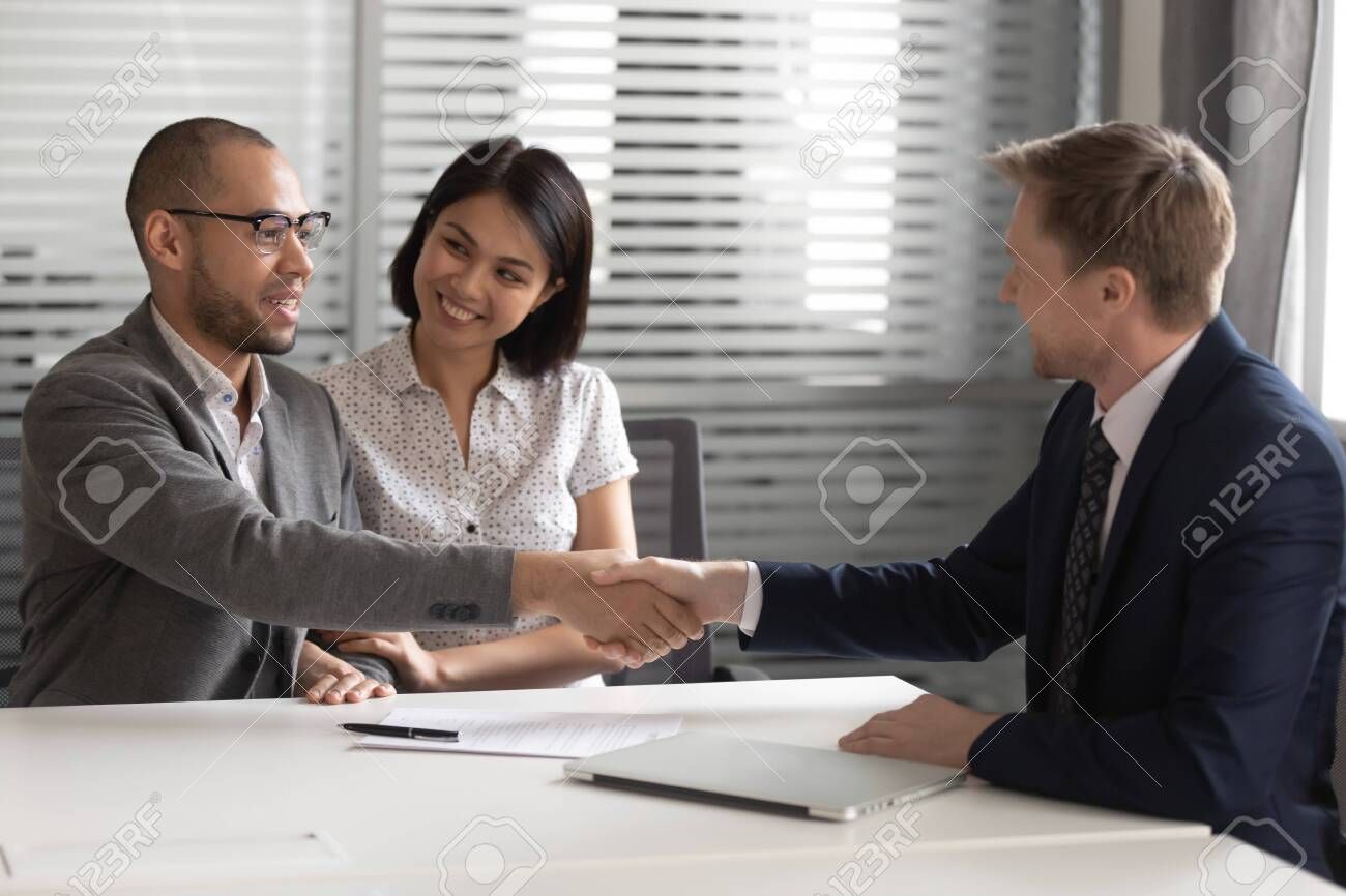 Professional business handshake representing partnership and trust in real estate consulting